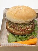 Burger with sprouts in cardboard box