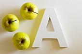 Three apples and the letter A