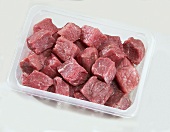 Diced beef in plastic container