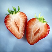 Two halves of a strawberry