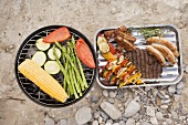 Vegetables on barbecue, grilled food in aluminium dish