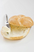 Buttered bread roll with knife