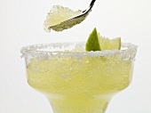 Frozen Margarita in glass and on spoon