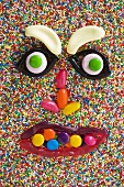 A face made from sweets on hundreds and thousands