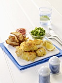 Breaded haddock with chips and peas