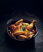 Fried chicken with vegetables in a pot