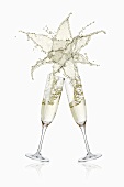 Clinking glasses of sparkling wine (with star-shaped splash)