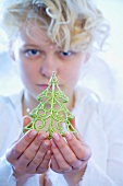 Girl with Christmas tree ornament