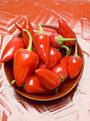 Red chillies in a red dish