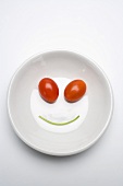 Vegetable face in a soup plate