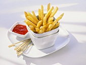 Chips in stacked pots with ketchup