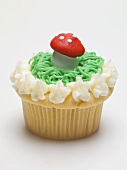 Cupcake with fly agaric mushroom for New Year's Eve