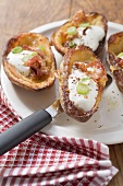 Baked potato skins with bacon and sour cream