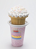 Birthday muffin with meringue topping on pink paper cup
