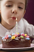 Little girl with birthday cake