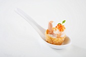 Croustade filled with garlic cream, prawn, salmon caviar on spoon