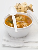 Goulash soup with small dumplings in a plastic tub