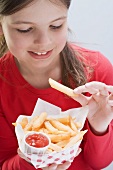 Girl eating a bag of chips
