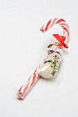 Candy cane and marzipan snowman (in packaging)