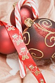 Candy cane and Christmas baubles
