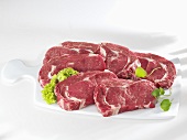 Entrecote steaks on ceramic chopping board