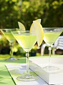 Apple Martinis on table out of doors