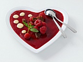 Raspberry dessert in heart-shaped dish