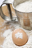 Egg, flour and flour sifter