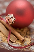 Christmas bauble and cinnamon on chocolate