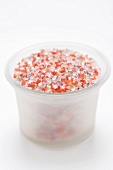 Coloured coarse granulated sugar in glass