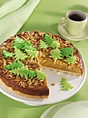 Marzipan cake with pine nuts and marzipan fir trees