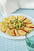 Potato and apple salad with spring onions and sesame seeds