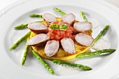 Rabbit loin & diced tomato on pancake, surrounded by asparagus