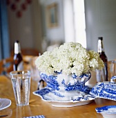Laid table with white flowers