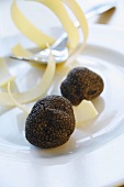 Black truffles (Chinese truffles) and ribbon pasta on plate