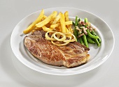 Pork neck steak with chips and green beans