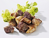 Fried cubes of pork and beef for goulash
