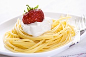 Spaghetti with soft cheese and strawberry