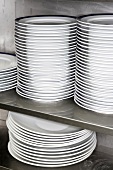 Piles of plates in professional kitchen
