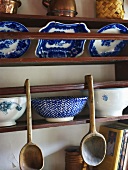 Blue and white porcelain on wooden shelves