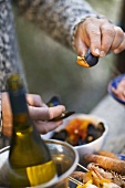 Man eating mussels