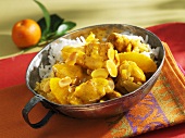 Chicken curry with oranges and rice