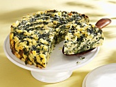 Pasta, spinach and ricotta cake, pieces removed