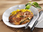Saltimbocca with saffron rice on plate