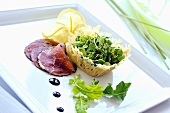 Beef carpaccio with watercress in Parmesan basket