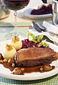 Duck breast with chestnuts, potato dumplings and red cabbage