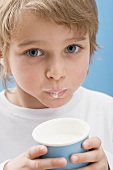 Little boy with milk round his mouth