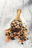 Mixed lentils on wooden spoon