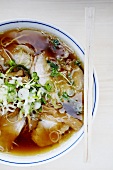 Ramen (Japanese noodle soup with pork and spring onions)