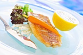 Fried red snapper with carrot and enoki mushrooms
